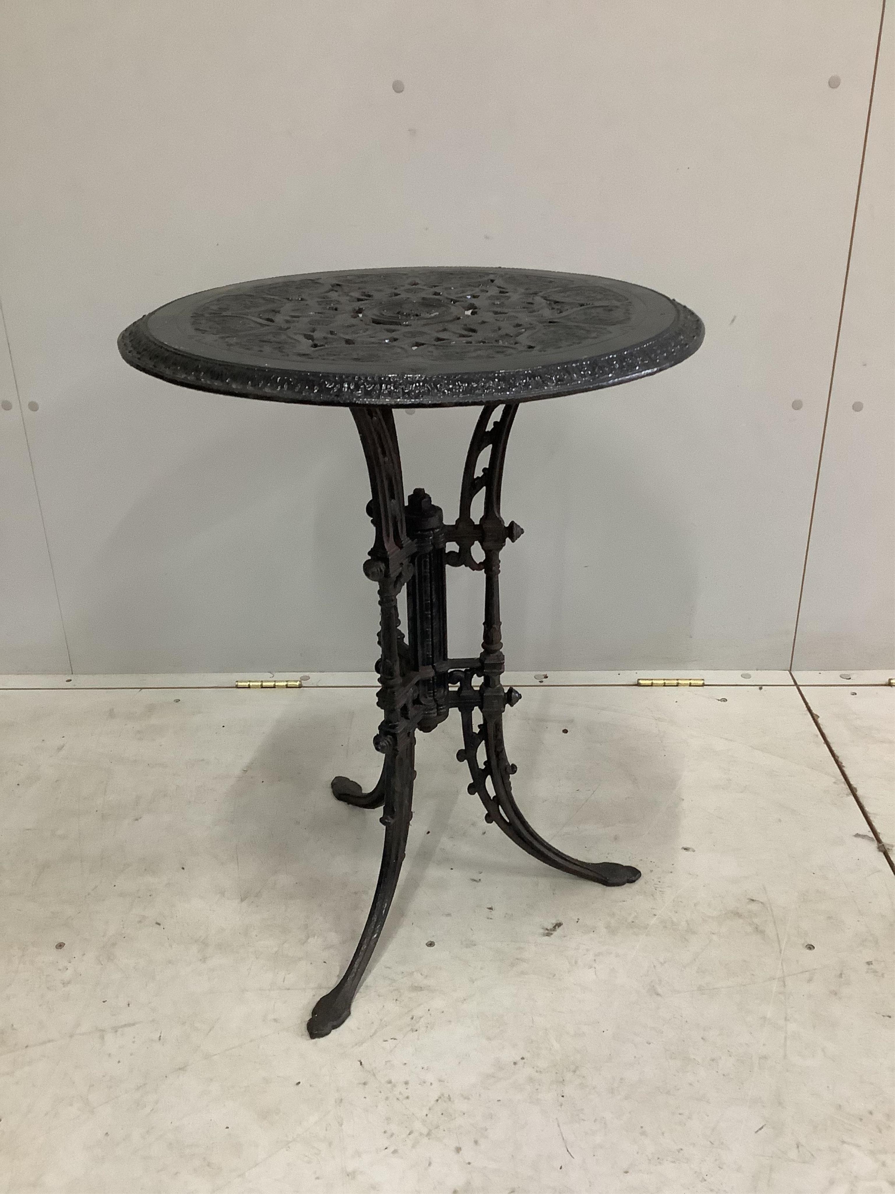 A Victorian black painted cast iron garden table, diameter 55cm, height 72cm. Condition - fair to good